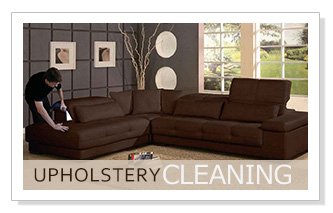 Carpet cleaning technician performing Upholstery Cleaning services to a micro fiber sectional sofa couch.